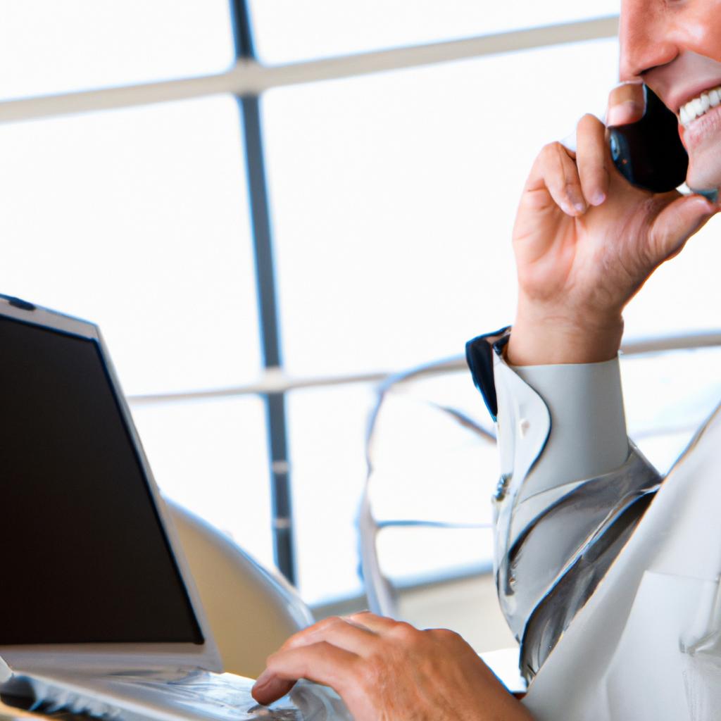 A businessman utilizing VoIP services for business communication on his laptop.